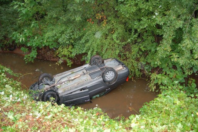 Car left the road  and went down gully into the creek. Two occupants self extricated. Gill Lane September 26, 2008.